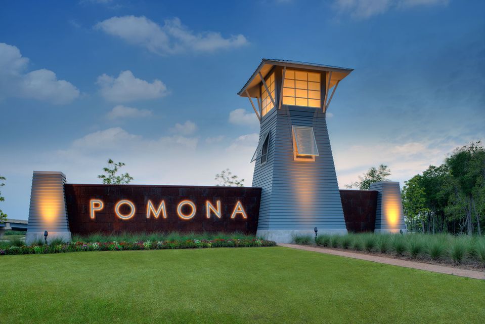 Pomona community sign and tower illuminated during sunset Pomona community sign and tower illuminated during sunset